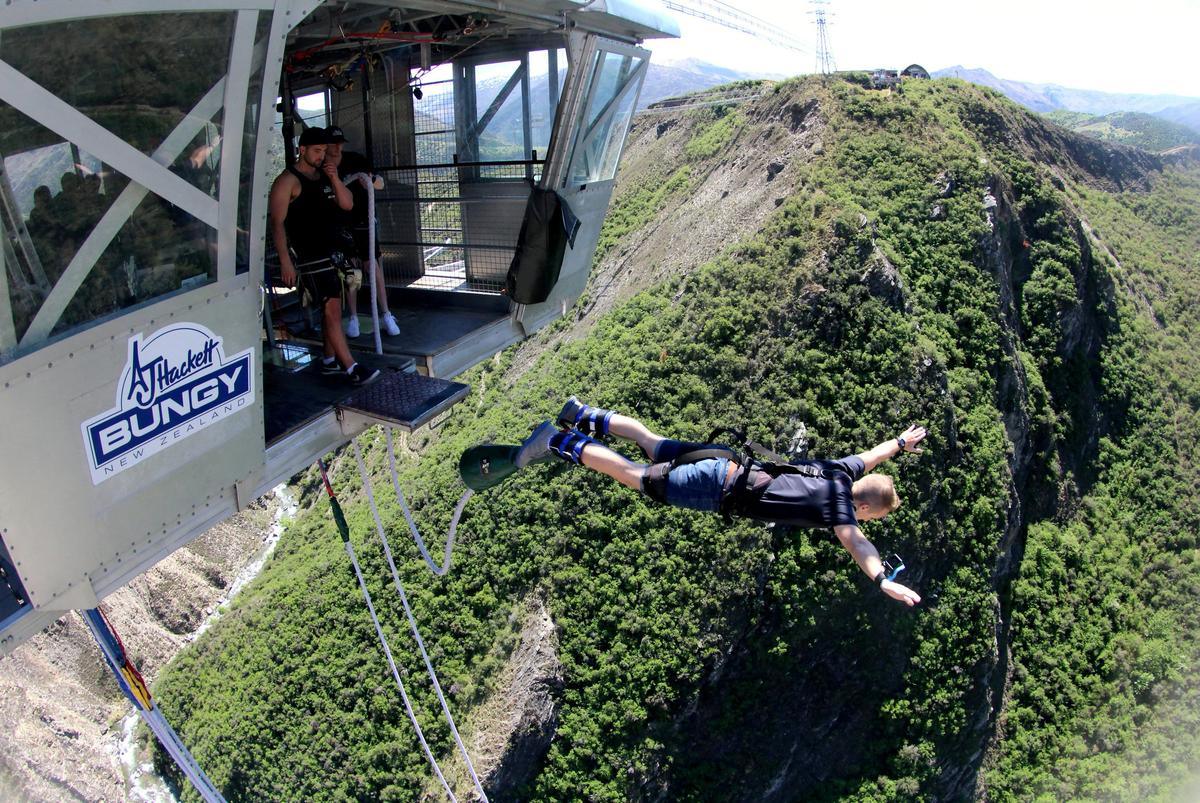 Sam doing a bungee jump in New Zealand before he was diagnosed with cancer. (SWNS)