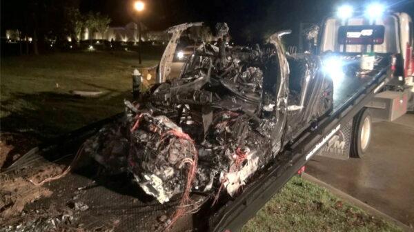 In this still image from video obtained via social media, the remains of a Tesla vehicle are seen after it crashed in The Woodlands, Texas on April 17, 2021. (Scott J. Engle via Reuters)