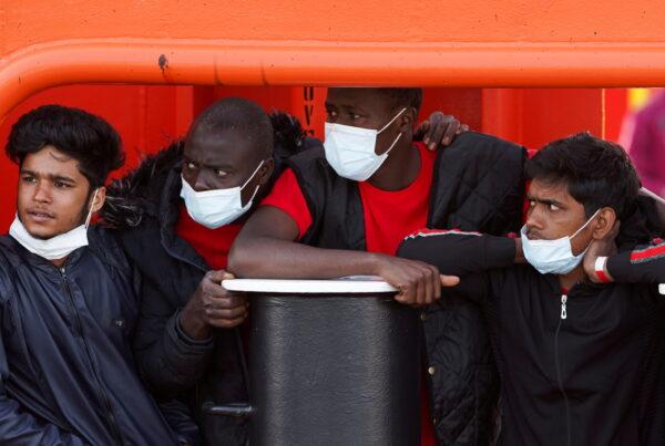 Illegal immigrants from the reception center wait on board the Asso Trenta ship to be transported to the quarantine ship GNV Azzurra, in Lampedusa, Italy, on May 11, 2021. (Antonio Parrinello/Reuters)