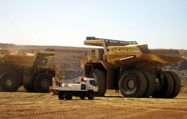 The world's largest dump trucks shifting earth at Citic Pacific Mining's Sino Iron magnetite iron ore project in the Pilbara region of Western Australia on Mar. 5, 2010. (AMY COOPES/AFP via Getty Images)