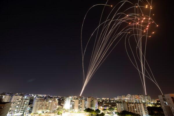 Streaks of light are seen as Israel's Iron Dome anti-missile system intercepts rockets launched from the Gaza Strip towards Israel, as seen from Ashkelon, Israel, May 11, 2021. (Nir Elias/Reuters)