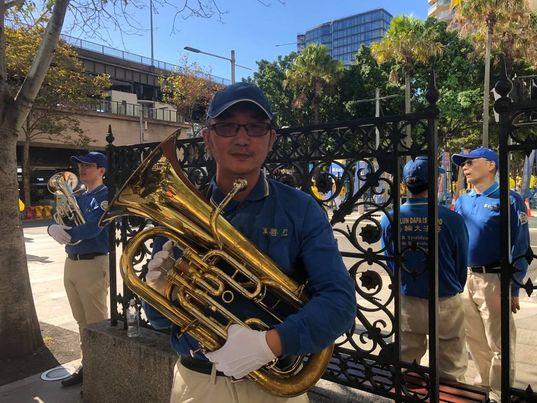 Tony Liu, a player of euphonium at the Tianguo marching band. (The Epoch Times)