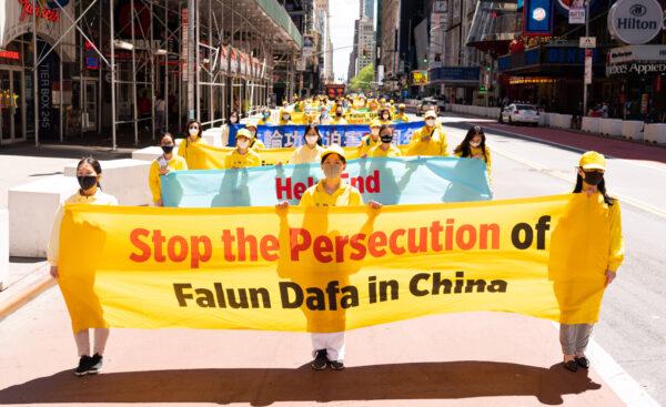 Practitioners of the spiritual discipline Falun Gong hold a parade in New York to celebrate World Falun Dafa Day and to protest the ongoing persecution of the group by the Chinese Communist Party, on May 13, 2020. (Larry Dai/The Epoch Times)