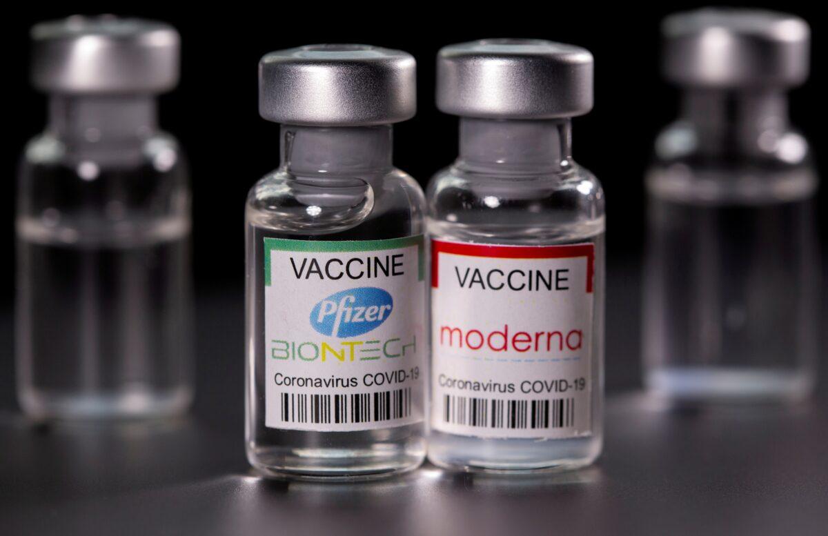 Vials with Pfizer-BioNTech and Moderna coronavirus disease (COVID-19) vaccine labels are seen in this illustration picture taken March 19, 2021. (Dado Ruvic/File Photo/Reuters)