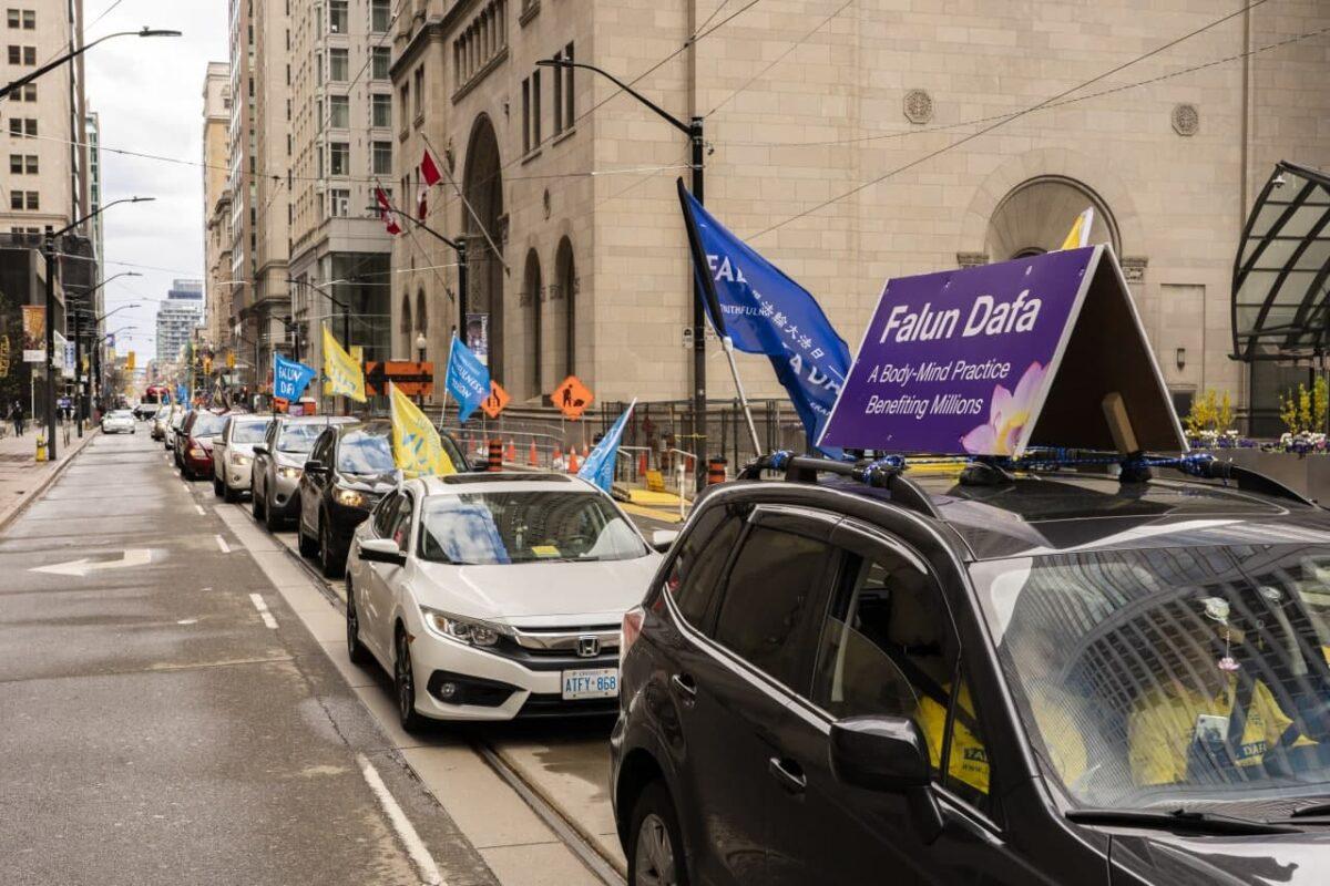 A car parade organized by Falun Gong practitioners goes through Toronto's city center and surrounding cities on May 8, 2021. (The Epoch Times)