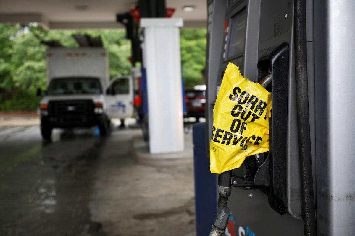A bagged nozzle at a pump notifies motorists that it no longer has fuel after a cyberattack crippled the biggest fuel pipeline in the country, run by Colonial Pipeline, in Chapel Hill, N.C., on May 12, 2021. (Jonathan Drake/Reuters)