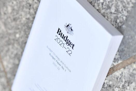 A stock image of the 2021-2022 Australian Federal Budget is seen on the ground at Parliament House in Canberra, Australia on May 12, 2021. (Sam Mooy/Getty Images)