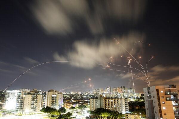 Streaks of light are seen as Israel's Iron Dome anti-missile system intercepts rockets launched from the Gaza Strip towards Israel, as seen from Ashkelon, Israel, on May 12, 2021. (Amir Cohen, Reuters)