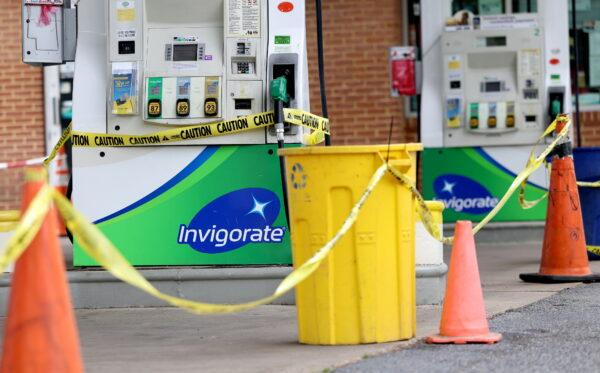 Gas pumps are roped off with a tape indicating a lack of gasoline at a gas station in Washington, on May 14, 2021. (Evelyn Hockstein/Reuters)