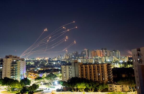 Streaks of light are seen from Ashkelon as Israel's Iron Dome anti-missile system intercepts rockets launched from the Gaza Strip toward Israel, on May 15, 2021. (Amir Cohen/Reuters)