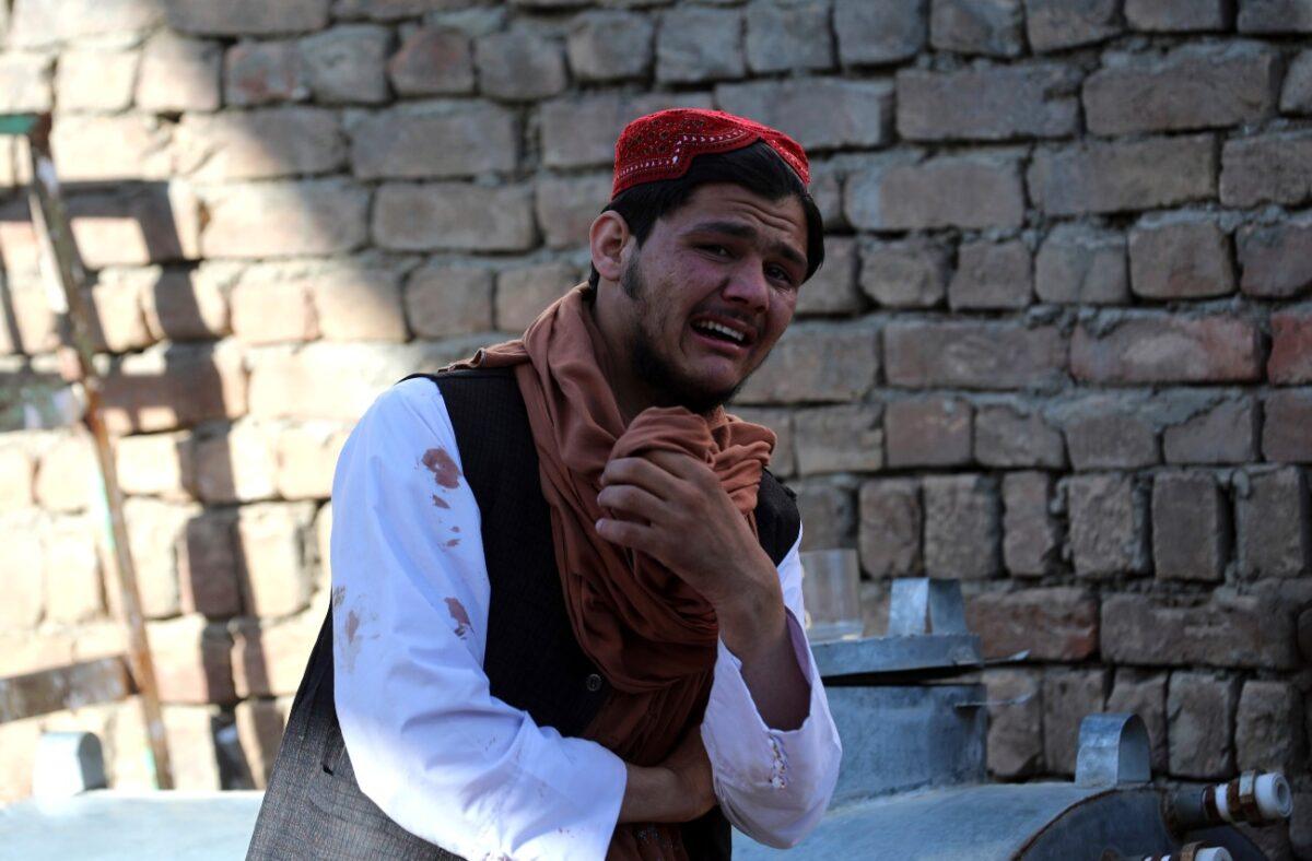A Religious student cry inside a mosque after a bomb explosion in Shakar Dara district of Kabul, Afghanistan, on May 14, 2021. (Rahmat Gul/AP Photo)