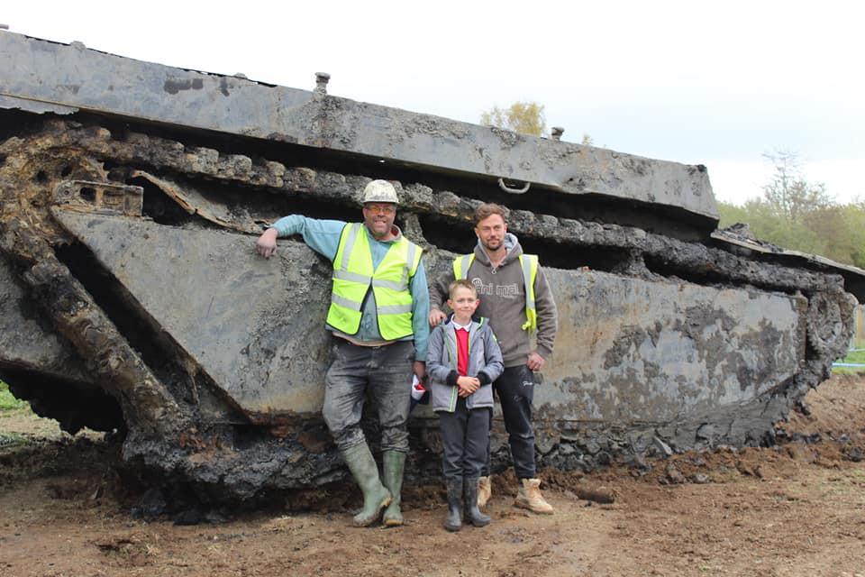 Daniel Abbott (L) and company stand in front of the Buffalo LVT (Courtesy of Daniel Abbott and the <a href="https://www.facebook.com/CrowlandBuffalos/">Crowland Buffalo LVT Association</a>).