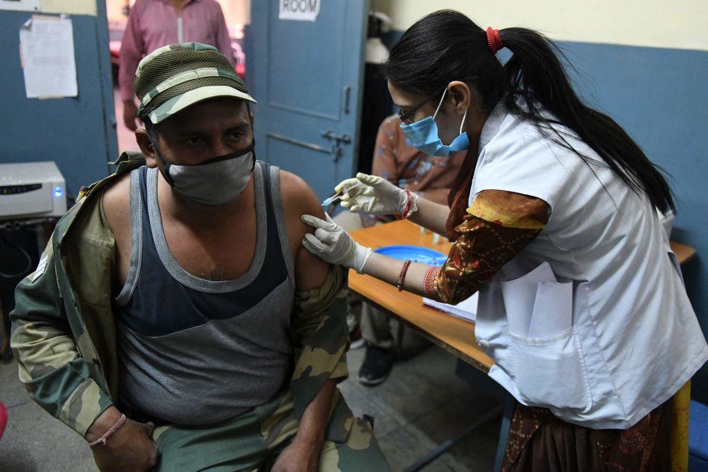 A medical worker inoculates a Border Security Force (BSF) personnel with a dose of the Covishield, ChAdOx1 nCoV-19 coronavirus vaccine, at a civil hospital in Ajnala village, about 17 miles from Amritsar on April 1, 2021, as India expanded its coronavirus vaccination drive to the 45-60 age group. (Narinder Nanu/AFP)