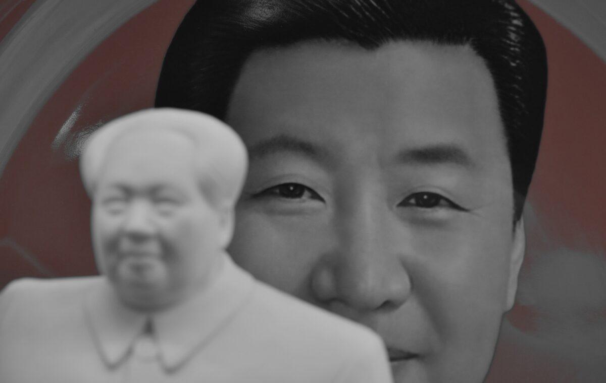 A decorative plate featuring an image of Chinese leader Xi Jinping is seen behind a statue of late communist leader Mao Zedong at a souvenir store next to Tiananmen Square in Beijing on Feb. 27, 2018. (Greg Baker/AFP via Getty Images)