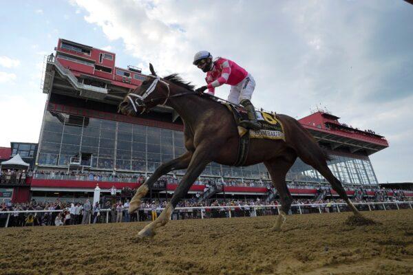 Flavien Prat atop Rombauer crosses the finish line to win the Preakness Stakes horse race at Pimlico Race Course, in Baltimore, on May 15, 2021. (Julio Cortez/AP Photo)