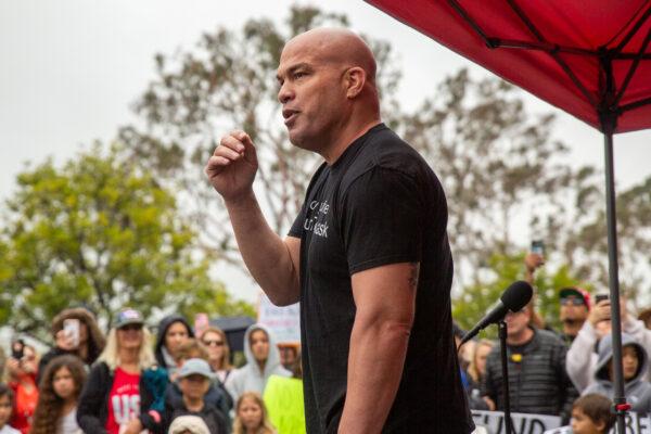 Huntington Beach Mayor Pro Tem Tito Ortiz speaks to parents and students as they gather in protest of wearing masks in schools outside the Orange County Board of Education in Costa Mesa, Calif., on May 17, 2021. (John Fredricks/The Epoch Times)