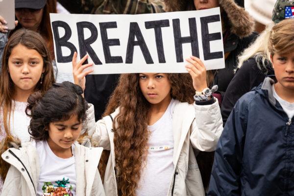 Parents and students gather to protest wearing masks in front of the Orange County Department of Education in Costa Mesa, Calif., on May 17, 2021. (John Fredricks/The Epoch Times)
