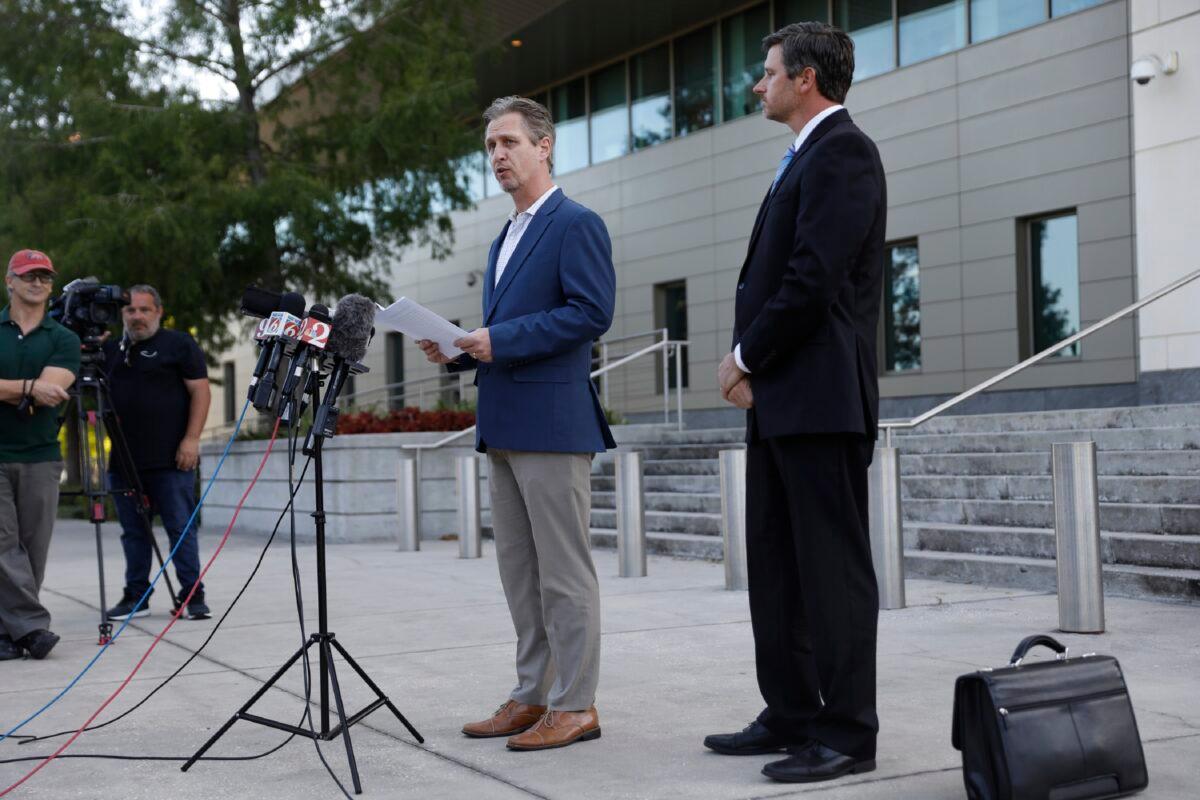 Brian Beute (L), a teacher at Trinity Preparatory School, appears with his attorney David Bear outside of the United States Federal Court House before Joel Greenberg, an associate of Rep. Matt Gaetz (R-Fla.), pleaded guilty to child sex trafficking and other charges, in Orlando, Fla., on May 17, 2021. (Octavio Jones/Getty Images)
