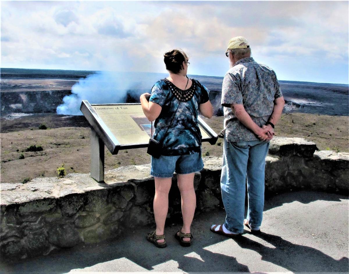 Visitors to Hawaii Volcanoes National Park take in the view. (Courtesy of Victor Block)