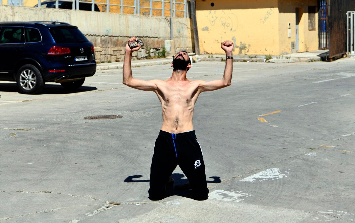 A man from Morocco reacts after entering swimming into the Spanish territory, at the Spanish enclave of Ceuta, on May 17, 2021. (Antonio Sempere/Europa Press via AP)