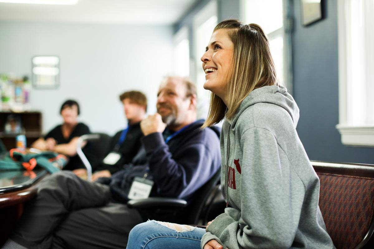 People during a meeting with John Shinholser, president and co-founder of The McShin Foundation, a nonprofit recovery community organization, in Richmond, Va., on May 12, 2021. (Samira Bouaou/The Epoch Times)