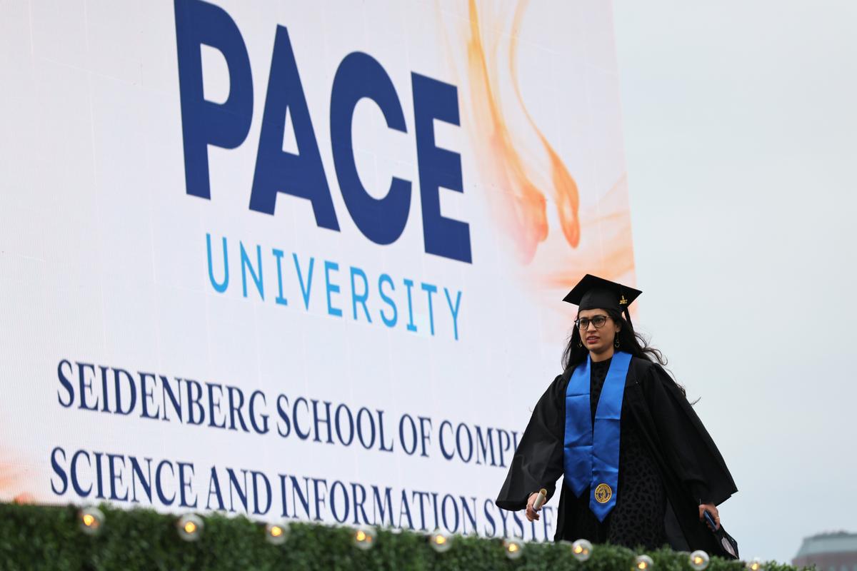 Jasmeet Ubhi walks the stage at a Pace University graduation ceremony at South Street Seaport in Manhattan on May 3, 2021. (Michael M. Santiago/Getty Images)