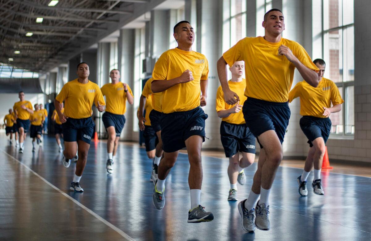 For some who join the armed forces, military boot camp serves as a rite of passage to manhood. Above, recruits run sprints during a U.S. Navy boot camp session in Great Lakes, Ill. (Spencer Fling/U.S. Navy)