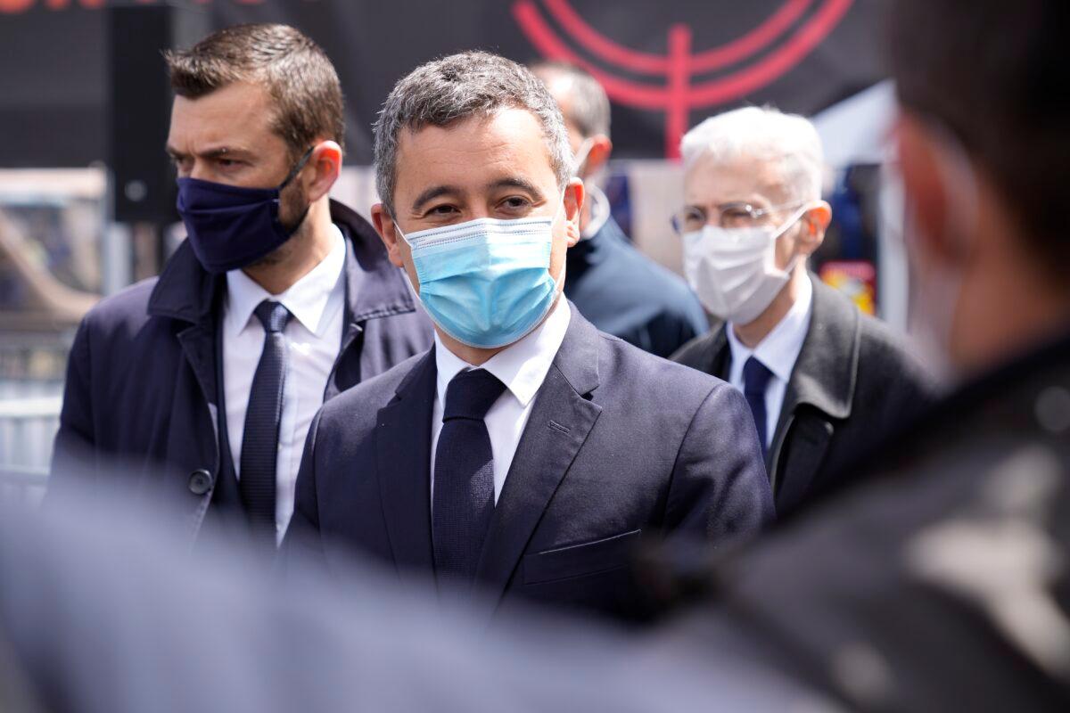 French Interior Minister Gerald Darmanin, center, meets police officers during a police officers demonstration in Paris, on May 19, 2021. (Michel Euler/AP Photo)