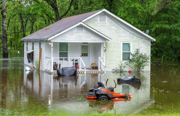 Water surrounds a house along flooded areas on Bluff Road in Ascension Parish, La., on May 18, 2021. (Bill Feig/The Advocate via AP)