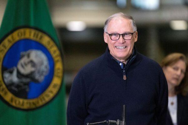 Washington State Gov. Jay Inslee and other leaders speak to the press in Seattle, Wash., on March 28, 2020. (Karen Ducey/Getty Images)