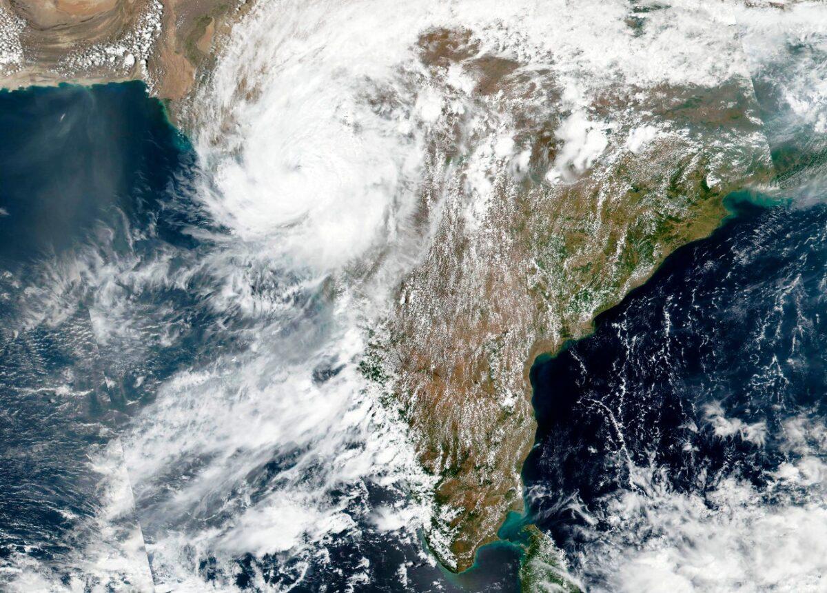 This satellite image released by NASA shows Cyclone Tauktae approaching India's western coast, on May 18, 2021. coast. (NASA Worldview, Earth Observing System Data and Information System (EOSDIS) via AP)