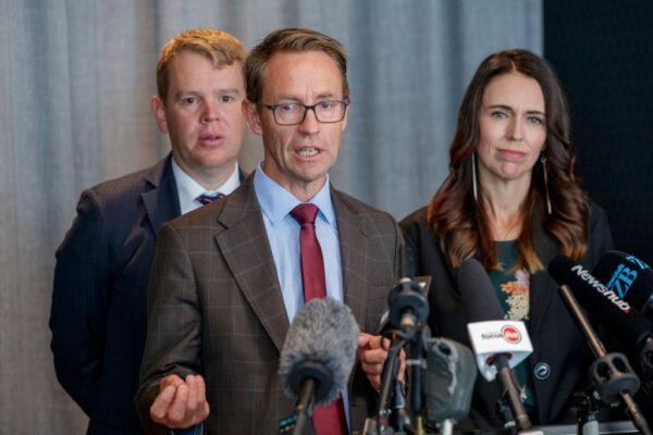 Minister for COVID-19 Response Chris Hipkins (L), Director-General of Health Ashley Bloomfield (C), and New Zealand Prime Minister Jacinda Ardern (R) at a press conference announcing the arrival of the Pfizer/BioNTech vaccine in Auckland, New Zealand, on Feb. 12, 2021. (Dave Rowland/Getty Images)