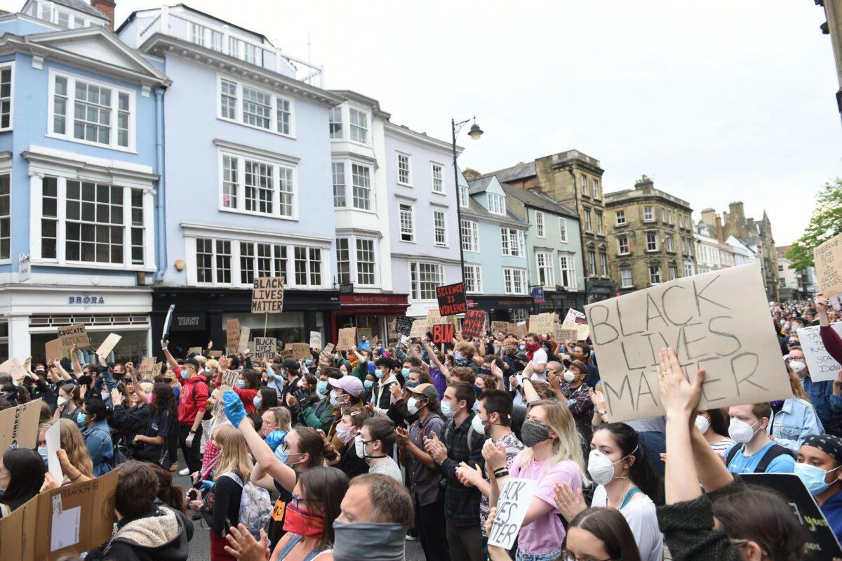 Protesters in Oxford city centre during a protest calling for the removal of the statue of 19th century imperialist, politician Cecil Rhodes from the Oriel college, Oxford, UK, issued on May 20, 2021. (Joe Giddens/PA)