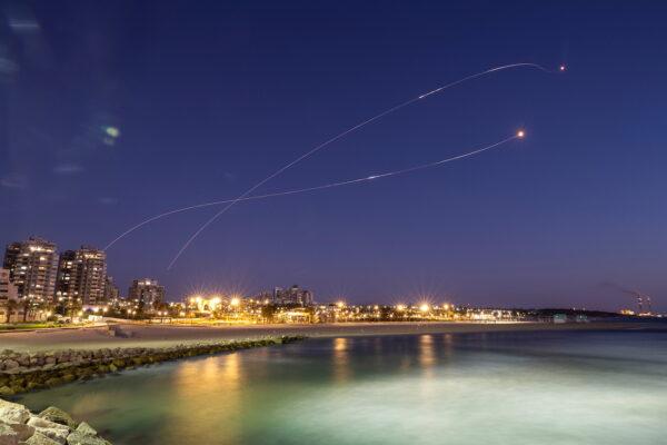 Streaks of light are seen as Israel's Iron Dome anti-missile system intercepts rockets launched from the Gaza Strip toward Israel, as seen from Ashkelon on May 19, 2021. (Amir Cohen/Reuters)