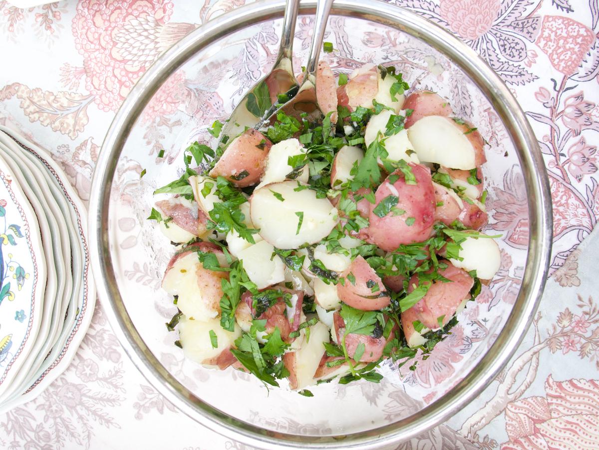 Fresh herbs enliven a simple potato salad. (Victoria de la Maza)