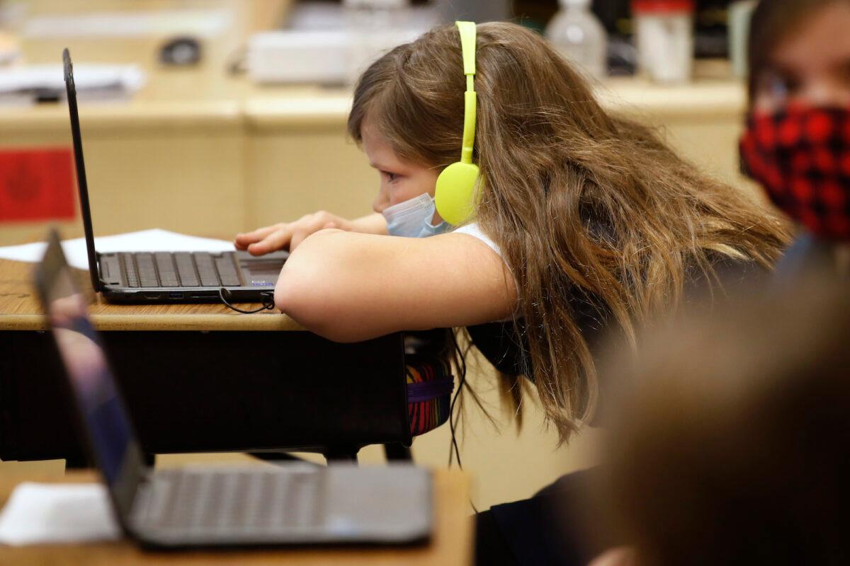 A student works on a computer at a Provo, Utah, school on Feb. 10, 2021. (George Frey/Getty Images)