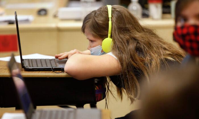 A student works on a computer at a Provo, Utah, school on Feb. 10, 2021. (George Frey/Getty Images)