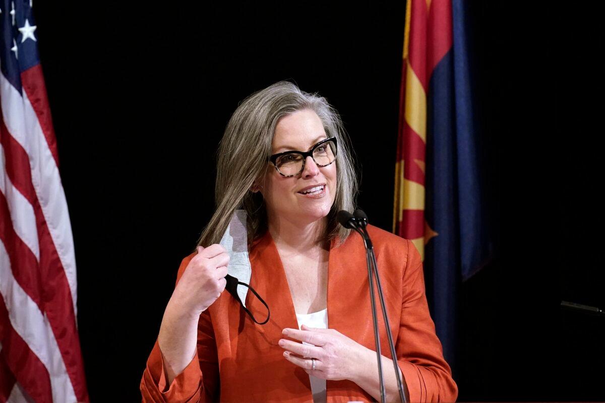 Arizona Secretary of State Katie Hobbs removes a mask as she speaks to members of Arizona's Electoral College prior to them casting their votes in Phoenix, on Dec. 14, 2020. (Ross D. Franklin/AP Photo)