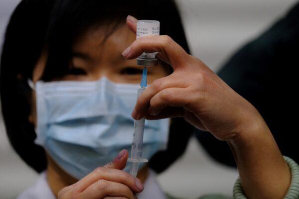 A medical staff prepares a vaccine against COVID-19 coronavirus at the Far Eastern Memorial Hospital in New Taipei City, Taiwan, on March 22, 2021. (SAM YEH/AFP via Getty Images)