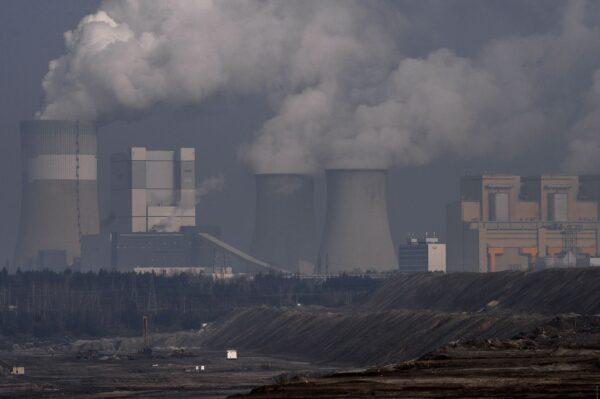 Steam and smoke rises from the Belchatow Power Station pictured from a viewing point over the open-pit coal mine in Rogowiec, Poland, on Feb. 23, 2021. (Omar Marques/Getty Images)