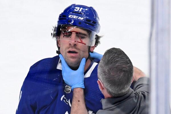 Toronto Maple Leafs forward John Tavares receives attention from a trainer after being injured during the first period against the Montreal Canadiens in Game 1 of an NHL hockey Stanley Cup first-round playoff series in Toronto, Canada, on May 20, 2021. (Frank Gunn/The Canadian Press via AP)