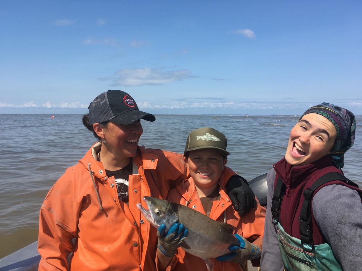Melanie Brown with her kids, Oliver Lamkin and Mariana Bell, and a freshly caught sockeye. (Courtesy of Melanie Brown)