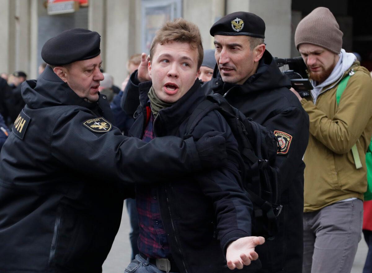 Belarus police detain journalist Raman Pratasevich (C) in Minsk, Belarus, on March 26, 2017. (Sergei Grits/AP Photo)