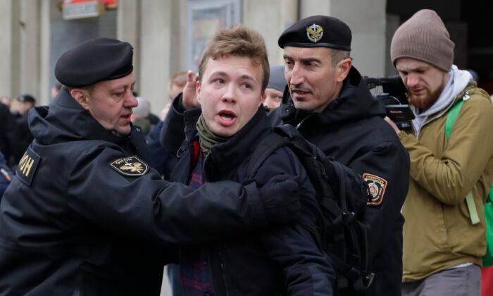 Belarus police detain journalist Raman Pratasevich (C), in Minsk, Belarus, on March 26, 2017. (Sergei Grits/AP Photo)