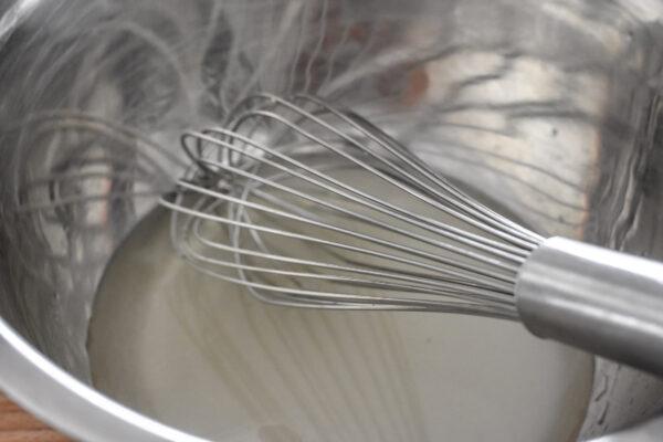 Whisk together the wine and sugar.