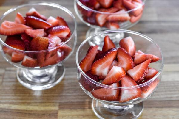 Place strawberries into individual serving cups.