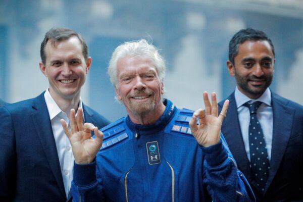 Virgin Galactic co-founder Sir Richard Branson, CEO George Whitesides and Social Capital CEO Chamath Palihapitiya pose together outside of the New York Stock Exchange in New York, on Oct. 28, 2019. (Brendan McDermid/Reuters)