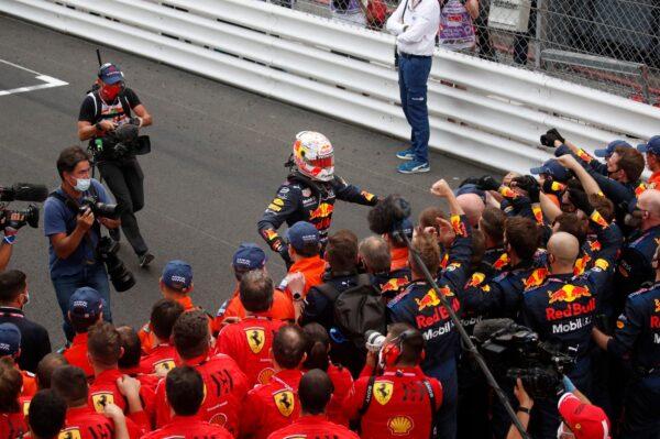 Red Bull driver Max Verstappen of the Netherlands (C) is congratulated by teammates after winning the Monaco Grand Prix at the Monaco racetrack, in Monaco, on May 23, 2021. (Gonzalo Fuentes/Pool via AP)