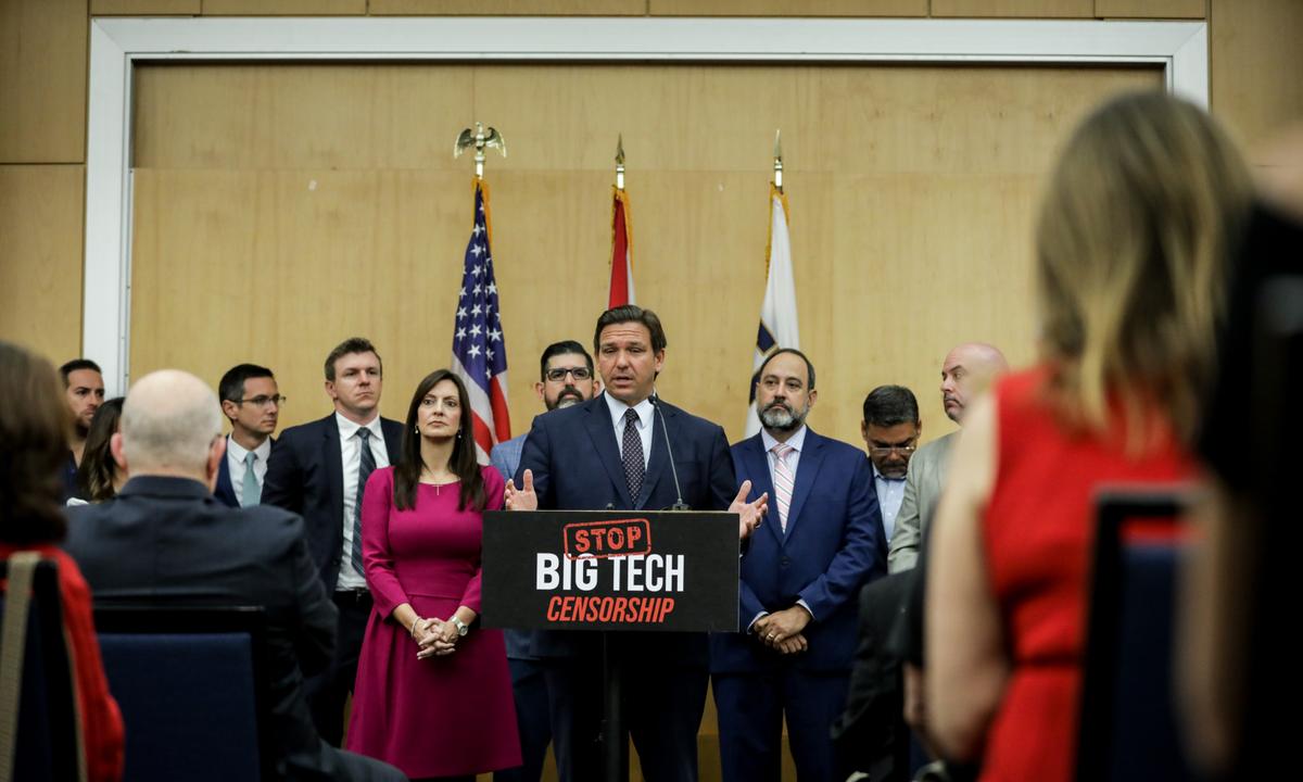 Florida Gov. Ron DeSantis speaks during a press conference before signing into law Senate Bill 7072 at Florida International University in Miami on May 24, 2021. (Samira Bouaou/The Epoch Times)
