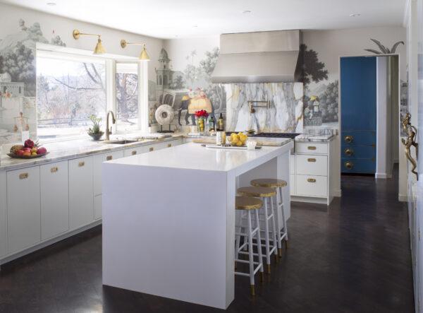 A kitchen in Denver, Colorado designed by Andrea Schumacher Interiors. The kitchen island and cabinetry is kept simple, with brass accents throughout. (Emily Minton Redfield)